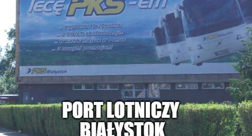 Bannery w pasach drogowych. Port lotniczy Białystok