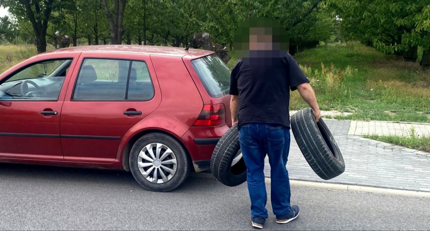 Podrzucił stare opony pod ogrodzenie cmentarza