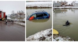 Samochód w stawie. Trwa akcja wydobywcza pojazdu [FOTO+aktualizacja]